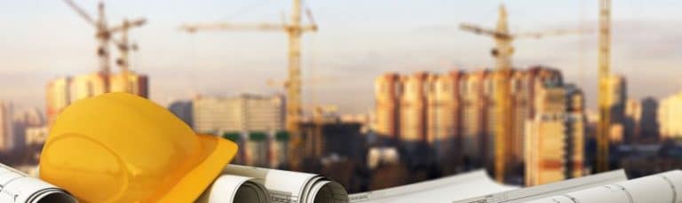 construction equipment overlooking buildings