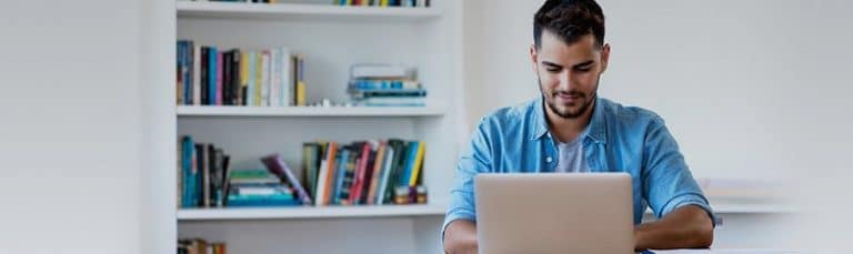 man working at a computer in an office