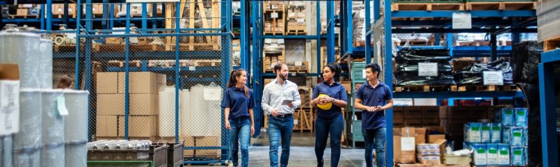 team walking through a warehouse