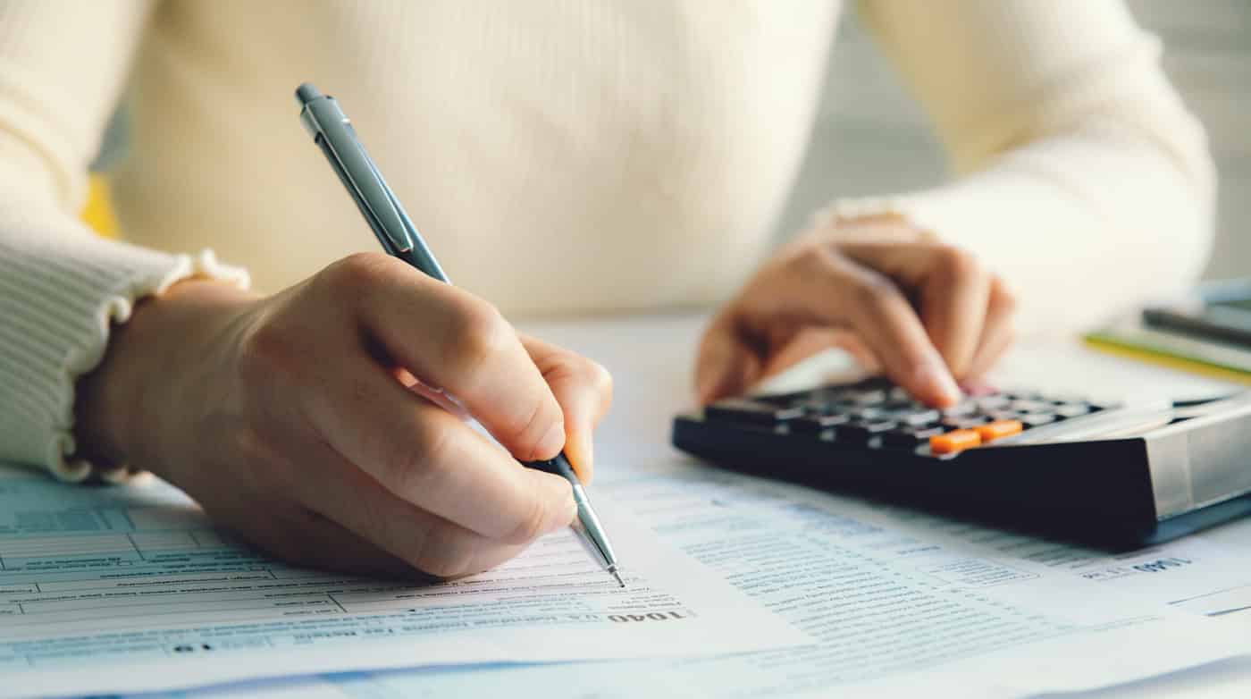 Woman filling out a 1040 tax document