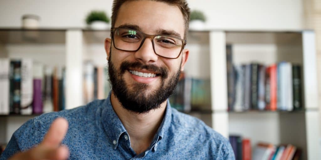 man with glasses smiling