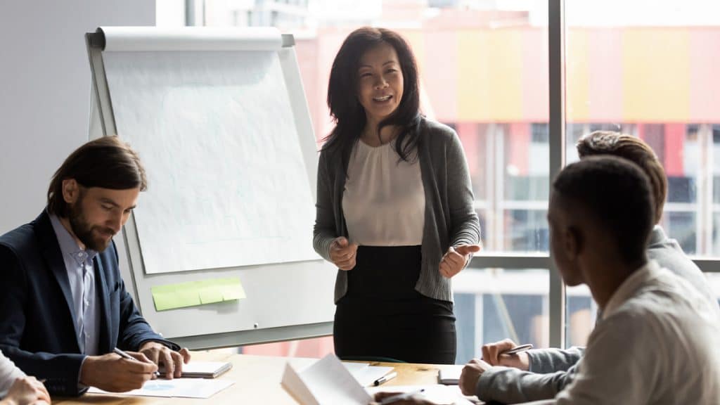 A businesswoman leads a meeting.