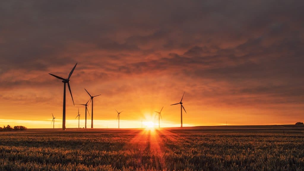 indmills working at sunset. These windmills could be a product liability risk if their components are not insured with product liability insurance for industrial products.