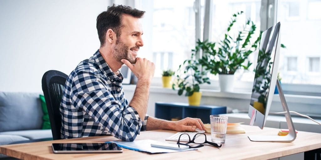 man looking at computer