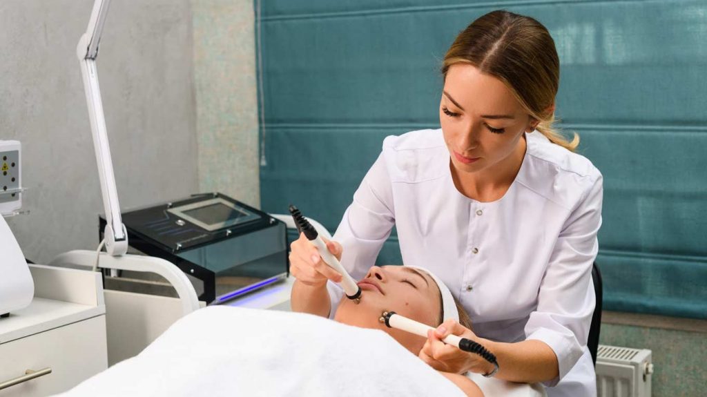 Woman getting a microcurrent facial