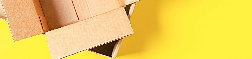 brown-boxes-stacked-on-yellow-background