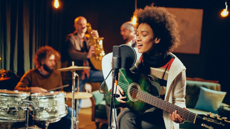 girl singing with guitar