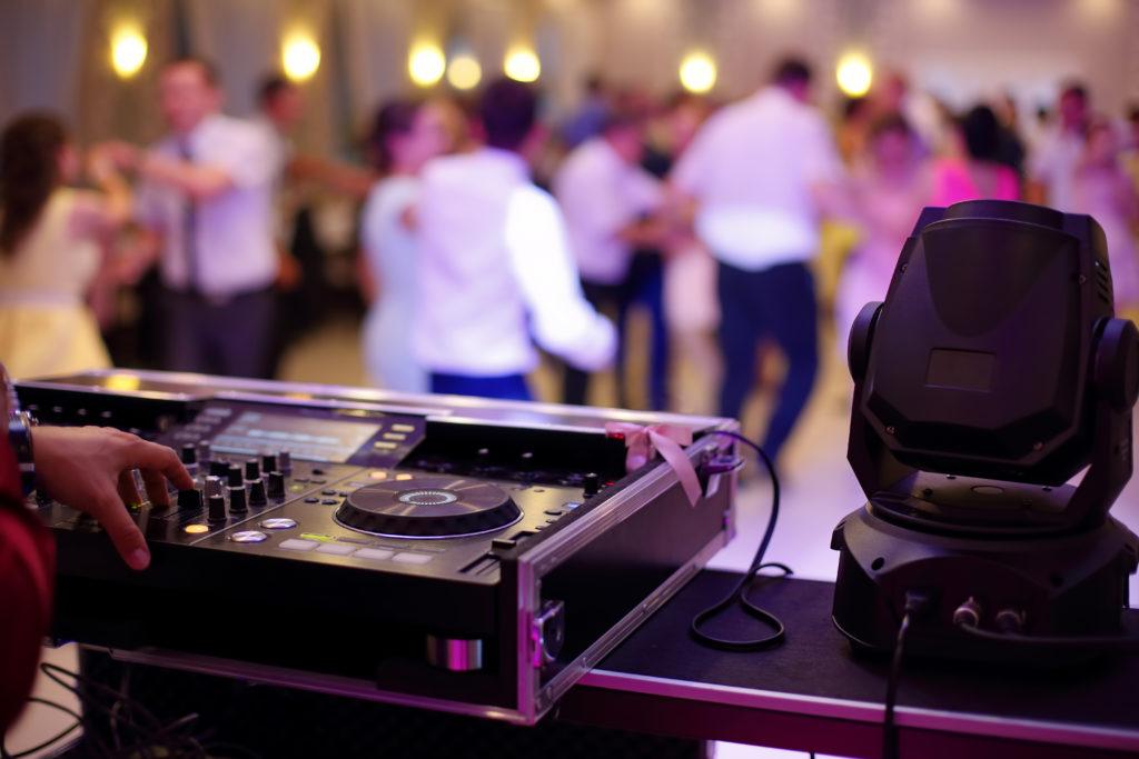 DJ setup at wedding with people dancing