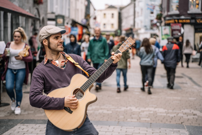 Man playing guitar in the street