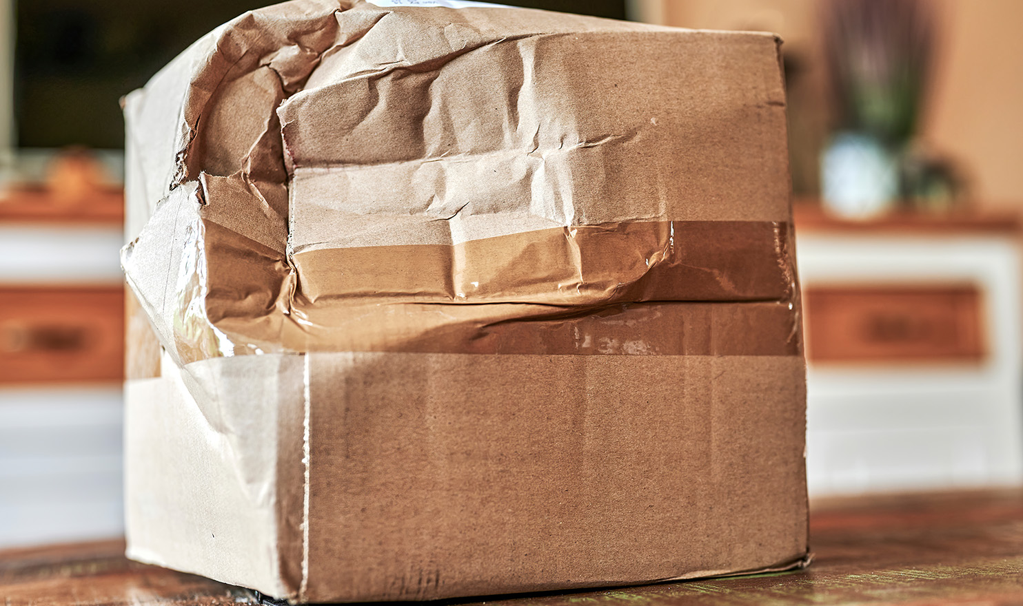 A damaged product box on a countertop. Having product liability insurance can help insure injuries or damages that come from faulty products.